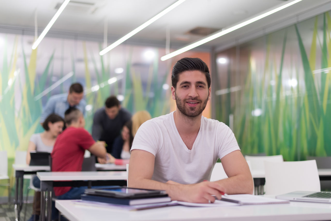 male student in classroom studying