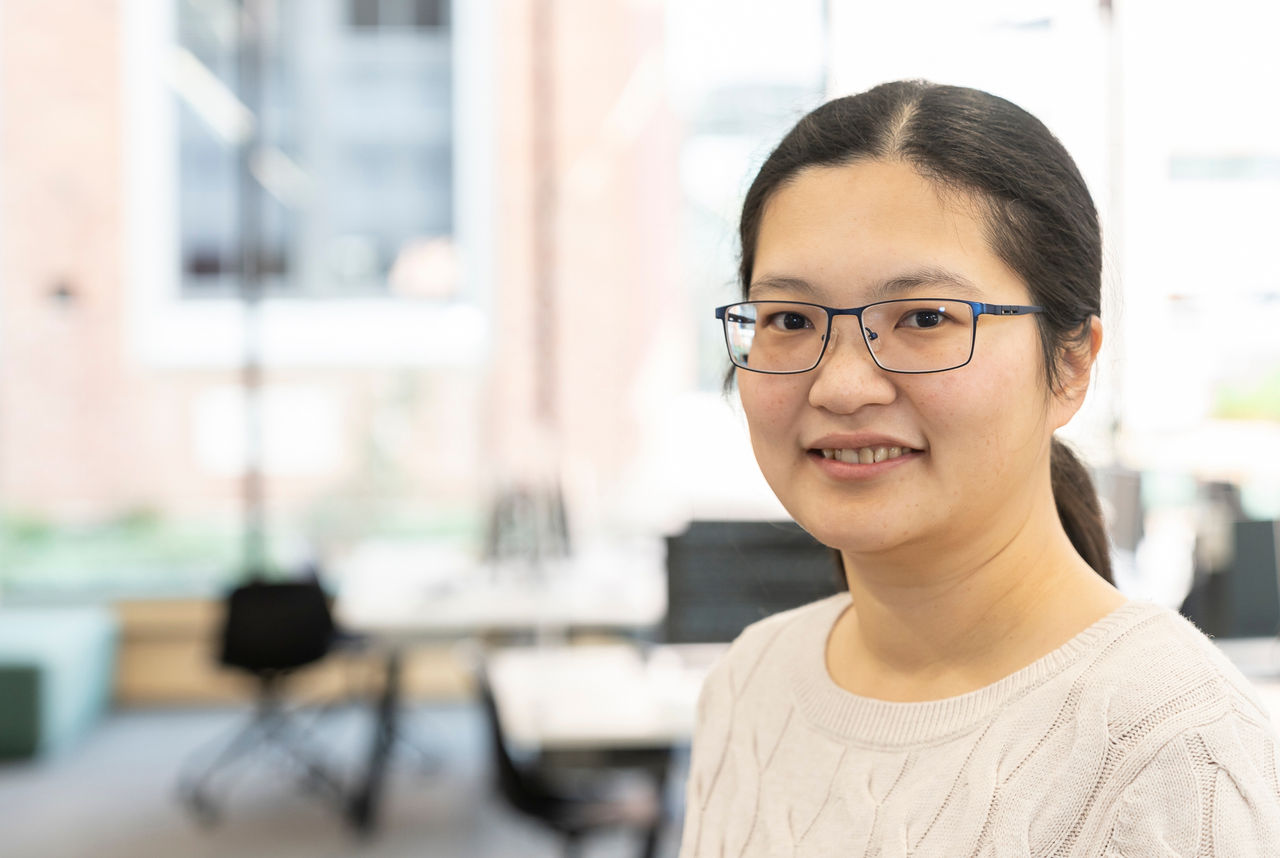 Woman wearing glasses and smiling